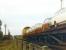 A Ford car train from Dagenham bound for the west country turning off the North London line at Acton Wells Junction in September 1968. The train will take the ramp down to join the GW main line at Acton East Junction. Locomotive in charge is Old Oak Common Brush Type 4 no D1639.<br><br>[John Furnevel 27/09/1968]