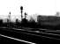 A type 2 emerges from the early morning mist as it leaves the north end of Millerhill yard with a mixed freight in August 1971. The train has just passed one of the yards long disused water towers as it takes the left fork at Niddrie South Junction and heads for the westbound <I>sub</I>.<br><br>[John Furnevel 21/08/1971]