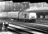 A Hymek leaving Paddington with a train for Worcester and Hereford, taken from Royal Oak Metropolitan Line station in May 1969. Part of Paddington's large parcels depot, with its dedicated platform, stand in the background.<br><br>[John Furnevel 05/05/1969]
