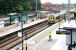 A Bedford - Sutton Thameslink service pulls into West Hampstead (Thameslink) in July 2006, just as a Midland Mainline express passes en route to St Pancras.<br><br>[John Furnevel 21/07/2006]