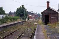 Dereham station and its environs looking distinctly post Judgement Day in July 1990, with all in sight deserted, overgrown and in ruins. The railway and its associated businesses and services had covered a substantial area of the town, but after the final activities had ceased the year before, it had all been left to decay. As we now know, some determined rail preservationists had another outcome in mind.<br><br>[Mark Dufton /07/1990]