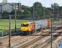 The two HNRC Class 20s (20311 and 20314) now outshopped in HNRC Orange worked from Washwood Heath to Kilmarnock as 5Z20 on 21 August 2012 with two barrier coaches. They were seen passing Farington Junction at 1817 hrs some 80 minutes late after a minor hiccup earlier in their journey.<br><br>[John McIntyre 21/08/2012]