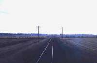 Looking east from Kinloss towards Elgin in the 1960s, with Kinloss station and level crossing behind the camera. [With thanks to Duncan McAdam, Gordon McRae and Ian Mackie] [See image 6103] [***Note: some doubts still exist regarding this location - confirmation awaited 230812]<br><br>[Frank Spaven Collection (Courtesy David Spaven) //]