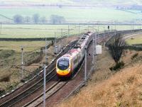 On a damp and misty morning in February 2005, a Glasgow Central - London Euston Virgin Pendolino snakes through the reverse curves on the approach to Crawford.<br><br>[John Furnevel 11/02/2005]