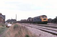 Brush Type 4 No. 47189 brings a long MGR  service past Trent Power Box (just out of sight beyond the railway cottages) in September 1981. The train is taking the Toton line. The Class 47 looks very presentable but only had a further eight years service ahead of it before withdrawal from Tinsley in 1989 and scrapping at MC Metals, Glasgow in 1992.   <br><br>[Mark Bartlett 01/09/1981]