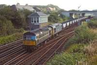 A Cockenzie PS to Westfield train of empty HAA wagons clatters over the diamond crossing at Dalmeny Junction on 9 October 1970. In charge are BRCW Type 2s Nos D5301 (still in green livery) and D5302 (repainted in rail blue). The down loop hasn't seen much use of late judging by the rust.<br><br>[Bill Jamieson 09/10/1970]