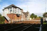 The level crossing at Longforgan in the Carse of Gowrie looking north east towards Dundee in September 2005. Beyond the signal box, on the other side of the crossing, is the remains of Longforgan station (closed to passengers in 1956) the main building of which is now a private residence.<br><br>[John Furnevel 02/09/2005]