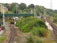 View south west over Normanton station on 26 August 2012 showing the wide loop required for the westbound platform line compared to the eastbound. 158790 has just called with the 12.34 Leeds - Sheffield. [See image 34201] <br><br>[David Pesterfield 26/08/2012]