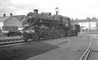 Gleaming Ivatt 4MT 2-6-0 no 43061, photographed in the yard at Doncaster Works in 1959. The locomotive is displaying a 40F Boston shed plate, its home between 1958 and the beginning of 1963. 43061 was eventually withdrawn from Colwick shed in January 1964.  <br><br>[K A Gray //1959]