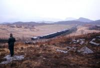 An eastbound goods from Kyle to Inverness near Duirinish in the mid 1970s. This is thought to be after the Stornoway ferry switched to Ullapool in 1973, following which freight to Kyle was conveyed on the early morning mixed train from Inverness, with just one return service a week for freight - this dedicated Saturdays-only train.<br><br>[Frank Spaven Collection (Courtesy David Spaven) //]