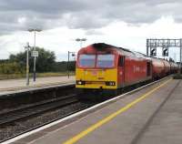 DBS 60063 runs east through Didcot station on 23 August 2012 with a train of oil tanks. <br><br>[Peter Todd 23/08/2012]