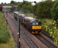 A Pair of WCRC Class 33s heading south on the WCML passed Farington on a dull and overcast 29 August 2012 with a single coach on a Carnforth to Southall working. <br><br>[John McIntyre 29/08/2012]