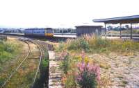 A 2-car DMU arriving at the platforms of the old Morecambe Promenade station in July 1989, approximately 5 years before final closure. [See image 34324]<br><br>[Ian Dinmore /07/1989]