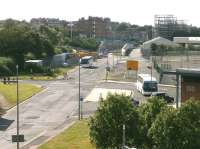 Site of the CR Leith North yard as seen looking west from the Ocean Terminal shopping centre in September 2012. The passenger station was out of shot to the left [see image 24799]. In the distance are abutments for the Granton branch of the Edinburgh Tramway, presently suspended.<br><br>[Bill Roberton 01/09/2012]