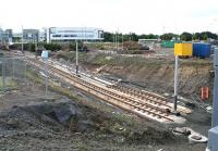 After leaving Gyle Centre the tram route to Edinburgh Airport drops to enter a tunnel below the A8 to reach the tram/train interchange at Gogar (to be called Edinburgh Gateway) on the north side. View south west on 30 August 2012 from above the tunnel, with the Gogar Roundabout visible in the right background.<br><br>[John Furnevel 30/08/2012]