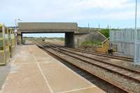 Georgemas Junction, looking towards Wick, on 6th July 2012. The new Dounreay flask loading facility is nearing completion beyond the bridge and to the right. The wagon in the siding was a bogie timber carrier and seemed to be in good (shiny) order but it was unclear if this was a <I>cripple</I> or in use for gauging etc in the new terminal. <br><br>[Mark Bartlett 06/07/2012]