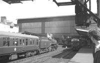 Polmadie class 5 4-6-0 no 73059 brings the 12.40pm Gourock - Leicester/Manchester into Carlisle on 17 July 1965. Standing alongside platform 3 is the down <I>Waverley</I> with the usual Holbeck 'Peak' in charge.<br><br>[K A Gray 17/07/1965]