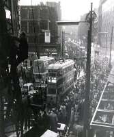 The last tram procession through Glasgow, taken 50 years ago today in the gathering dusk, with 100 ASA film and no tripod, from scaffolding in Jamaica Street. Note the eejit climbing the crane jib alongside!<br><br>[Colin Miller 04/09/1962]