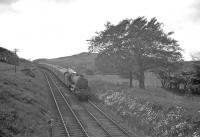 Ardrossan based Black 5 no 45251 with a St Enoch - Largs service, photographed under a grey and heavy sky near West Kilbride in 1961.<br><br>[R Sillitto/A Renfrew Collection (Courtesy Bruce McCartney) //1961]