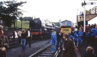 BR Standard Pacific no 70000 <i>'Britannia'</i> stands next to a Western class diesel hydraulic in the yard at Bridgnorth on the Severn Valley Railway on a rainy day in July 1979.<br><br>[John McIntyre /07/1979]