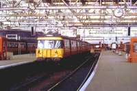 303001 at Glasgow Central in November 1987, waiting to depart with a service to Neilston.<br><br>[Graham Morgan Collection 07/11/1987]