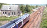 An Edinburgh - Perth train speeds past the site of Greenloaning station (1848-1956) in the summer of 2005.<br><br>[John Furnevel 21/06/2005]