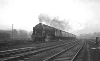 The 9.25am Crewe - Perth seen passing Carlisle Kingmoor shed on 23 January 1965. Locomotive in charge is Royal Scot no 46152 <I>'The King's Dragoon Guardsman'</I>.<br><br>[K A Gray 23/01/1965]