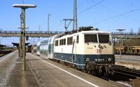 The 10.17 Regional Express from Landshut has just arrived at Plattling, a railway junction of some importance on the main line from Regensburg to Passau. In charge of four double deck coaches is class 111 electric No. 111207, the whole ensemble displaying a motley selection of liveries dating from the mid seventies through to the early 21st century.<br><br>[Bill Jamieson 08/03/2002]