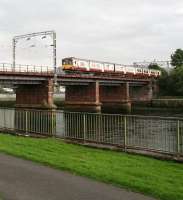 The 13.58 Partick - Balloch crossing the River Leven between Dumbarton Central and Dalreoch on Sunday 9 September 2012 in light but persistent rain.<br><br>[John Furnevel 09/09/2012]