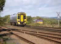 158707 heads north at Thornton Junction on 11 September, passing 66140 lurking on the former Methil branch with a coal train from Earlseat to Hunterston. [See image 40284]<br><br>[Bill Roberton 11/09/2012]