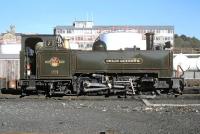 The black flags say it all - this was the real end of BR steam at the cessation of the 1988 Vale of Rheidol summer season, which extended into early November that year. No. 7 <I>Owain Glyndwr</I> waits to back down into Aberystwyth station to couple up to the 14.00 departure for the last time.<br><br>[Bill Jamieson 04/11/1988]