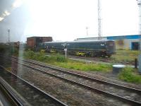 Former First Great Western Motorail vans stabled on the siding running through the now tankless water tower structure near the Colas Rail maintenance facility at Cardiff Canton. There are plans to use the vehicles on a trial working by Colas between Euston station and Daventry.<br><br>[David Pesterfield 07/08/2012]