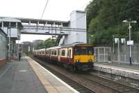 Looking west along platform 3 at Dalmuir on 9 September 2012. The train standing at platform 4 is the Sunday 14.41 Balloch - Partick. The modern footbridge/lift combination here was commissioned in 2010 and serves all 5 platforms. <br><br>[John Furnevel 09/09/2012]