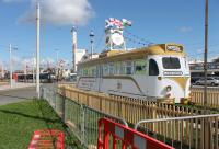 Another temporary static illuminations exhibit, alongside the tramway in Blackpool, is Brush Railcar 627. This has been specially repainted for the Jubilee and positioned on a temporary piece of track in the middle of the Pleasure Beach turning circle. It is good to see Blackpool valuing these old vehicles although the amount of fencing around the old tram seemed excessive. A modern day successor passes by in the background.<br><br>[Mark Bartlett 11/09/2012]