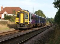 An eastbound Blackpool - York service approaching Hospital Inn level crossing just to the east of Bamber Bridge station on 8 September 2012.<br><br>[John McIntyre 08/09/2012]