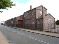 The restored Hood Road Goods Shed in Barry on 12 September 2012. Hood Road itself runs alongside the building and a footpath has now replaced what were once reception roads for the scrapyard. For the view forty five years earlier [see image 23481].<br><br>[David Pesterfield 12/09/2012]