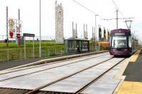 With illuminations displays behind along the cliffs, southbound Flexity tram 012 departs from Lowther Avenue heading for Blackpool town centre on 8 September 2012. [See image 31101] for the same location two years earlier.<br><br>[Mark Bartlett 08/09/2012]