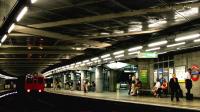 A District Line service arrives at Westminster in July 2005 heading for Barking.<br><br>[John Furnevel 24/07/2005]