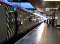 Coventry station is built just off East-West, leading to interesting lighting effects at dawn and dusk. A Pendolino for Birmingham prepares to leave the station at dusk on 8th September. [see image 34123].<br><br>[Ken Strachan 08/09/2012]