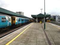 Busy scene at the south side of Cardiff Central on 7 August 2012. On the left units 150241 and 158954 (the latter on the 07.23 ex Portsmouth Harbour) arrive together at opposite ends of platform 4 to sandwich 150283. Meantime 143605 and 143624 run into platforms 6 & 7 on Valley Line services. Shortly afterwards 150241 reversed to leave on the 10.51 to Treherbert via City line, whilst 150283 formed the heavily loaded 10.57 two stop service to Fishguard Harbour.<br><br>[David Pesterfield 07/08/2012]