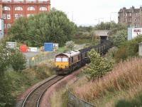 Russian coal on its way to Cockenzie power station in September 2006. EWS 66095 has brought the train from the import terminal in Leith Docks and has just passed below the A1140 road bridge heading for Portobello West Junction and the ECML.<br><br>[John Furnevel 16/09/2006]