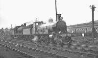 Scene in the shed yard at Carstairs on 30 June 1963 where locomotives 103+57581 have been prepared to take over the RCTS (West Riding Branch) <I>Three Summit Rail Tour</I> from no 46255 <I>City of Hereford</I>. The pair will take the special on to Auchinleck via Lanark Junction and Muirkirk before handing over to no 60004 <I>William Whitelaw</I> for the start of the return journey south to Leeds City [see image 34626].<br><br>[K A Gray 30/06/1963]