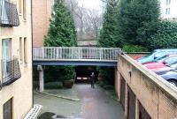 A pedestrian emerges from the north portal of The Edinburgh and Dalkeith Railway's St Leonards Tunnel, just 400m short of the former terminus, in January 2008. On the upper level is Holyrood Park Road, while the far end of the 320m long tunnel emerges into the park itself.<br><br>[John Furnevel 02/01/2008]