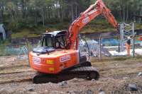 A Network Rail team erecting the new mast at the South end of Carrbridge station as part of their new private radio network on 20 September 2012. The old south signal box is just visible in the background. This is one of the last masts to be erected on this section of the line, those at Moy, Slochd, Aviemore and Kinveachy having been installed a few weeks earlier.<br><br>[Gus Carnegie 20/09/2012]