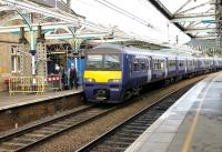 The well travelled 322482 rolls into Skipton on a service from Bradford Forster Square in September 2012. The EMU has previously been used on the North Berwick branch and Stansted Express services [see image 32813] but joined Northern almost a year ago. The canopies at Skipton are currently being renovated.<br><br>[Mark Bartlett 20/09/2012]