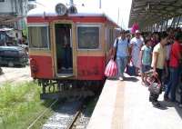 Scene at Alabang, the outer limit of daytime commuter trains from Tutuban terminus. If you can't afford 30p for the 28km ride to Tutuban on a Hyundai DMU [see image 40307] it's best to wait for one of these second hand Japanese DMU's to turn up. They may substitute whirling ceiling fans for the full air conditioning of the Hyundais, but the fare is a more reasonable 25p. Please don't ask what the fishing nets are doing on the left. It's a Philippines thing.<br><br>[Ken Strachan 01/09/2012]