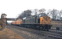 A gloomy Tuesday afternoon in April 1970 as EE Type 4 No. 252 passes Newhailes Junction with the 11.50 Aberdeen to Kings Cross Freightliner service. The single track of the by then freight only Musselburgh branch runs immediately to the right of the locomotive.<br><br>[Bill Jamieson 14/04/1970]