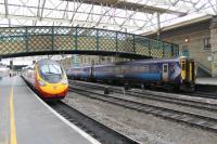 As Pendolino 390005 leaves Carlisle Citadel for London, Scotrail's 156508 is seen stabled on the opposite through road before returning north on a GSWR line service.<br><br>[Mark Bartlett 20/09/2012]