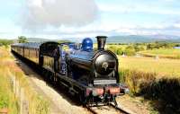 Saturday, September 22nd 2012, turned out to be a bright Autumn day and the sun is shining on Caledonian Railway 0-6-0 No. 828 as it heads from Broomhill towards Boat of Garten with the afternoon train for Aviemore. The engine is spotless and the paintwork gleaming, a credit to all the volunteers who work the Strathspey Railway. In the background the River Spey meanders its way to the Moray Coast.<br><br>[John Gray 22/09/2012]