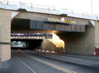 The 'chunky' new bridge built to carry Edinburgh's trams across Russell Road, photographed looking south on Sunday morning 23 September 2012. Empty stock stabled in the sidings at Haymarket depot can be seen in the background, with the E&G main line running beyond. [See image 38430]<br><br>[John Furnevel 23/09/2012]